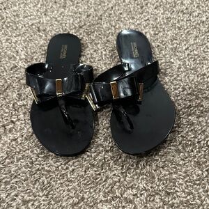 Michael Kors Black Thong Sandals with Gold Details